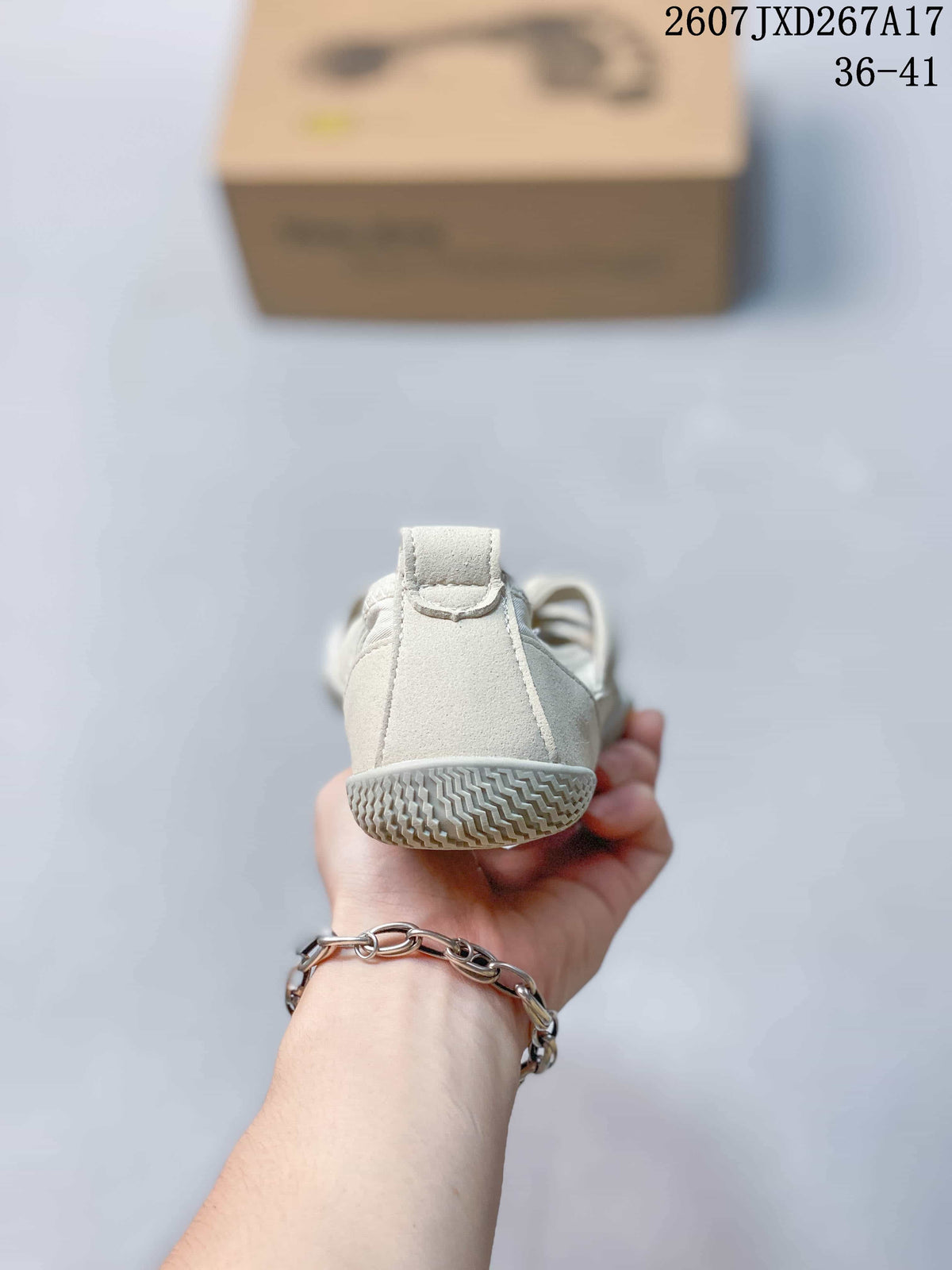 Rear view of an off-white five-finger shoe showing the heel pull tab and textured outsole.