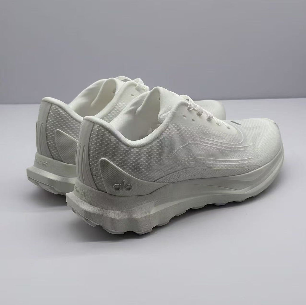 Rear three-quarter view showing the padded heel collars, heel branding, and outsole edge.