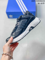Side view highlighting the layered dark upper, mesh panels and white midsole.