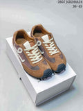 Pair of brown and gray Loewe low-top sneakers with cream laces, blue heel accents, and a white shoebox.