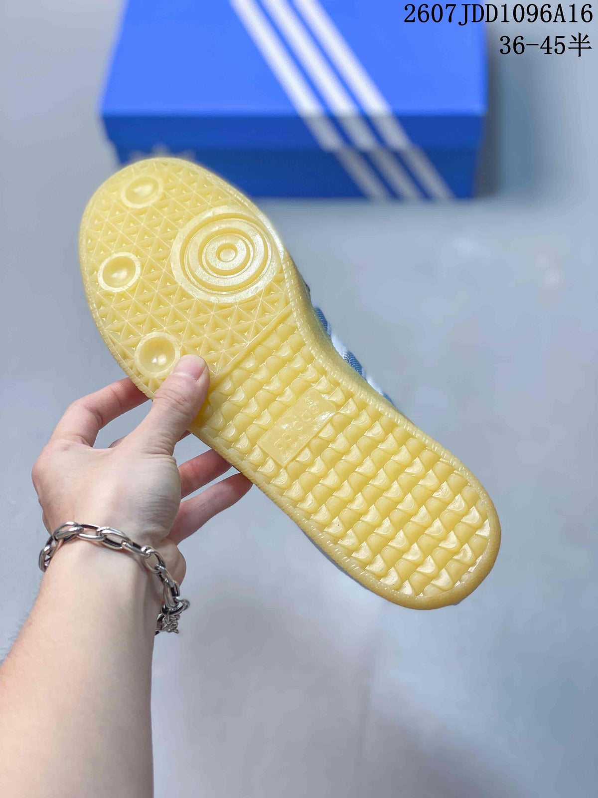 Close-up of the textured gum-colored outsole with circular and geometric tread details.