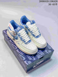 Pair of white and blue Nike Air Force 1 Low sneakers with frayed denim trim