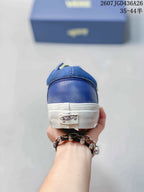 Rear view of the blue sneaker showing the white heel sole and Vans Off The Wall heel label.