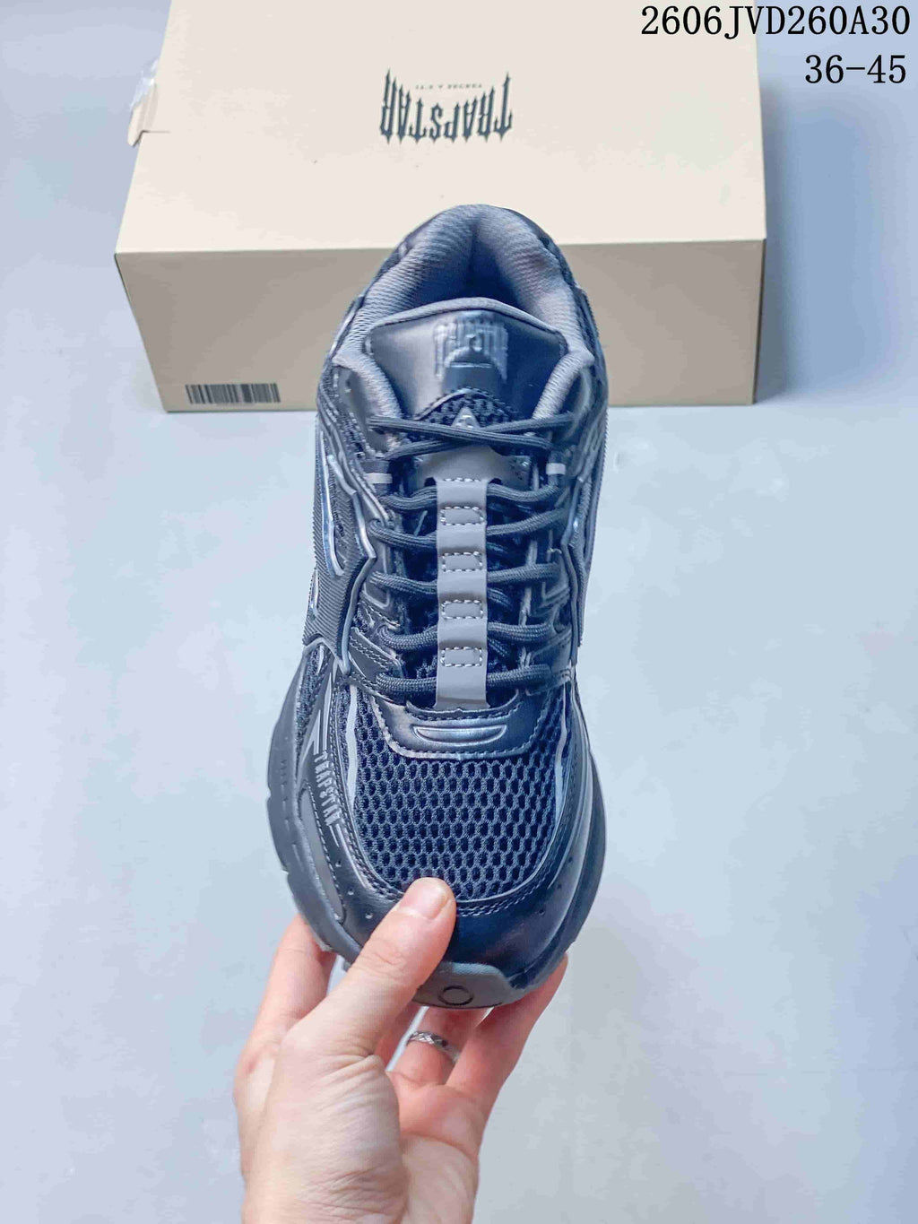 Top view of a gray lace-up sneaker with mesh panels