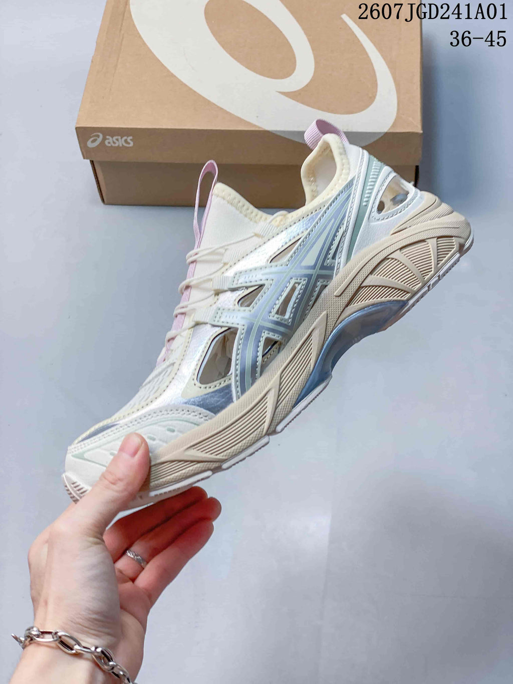 Side profile of a cream ASICS GT-2160 Breeze sneaker with blue-gray overlays and open side details