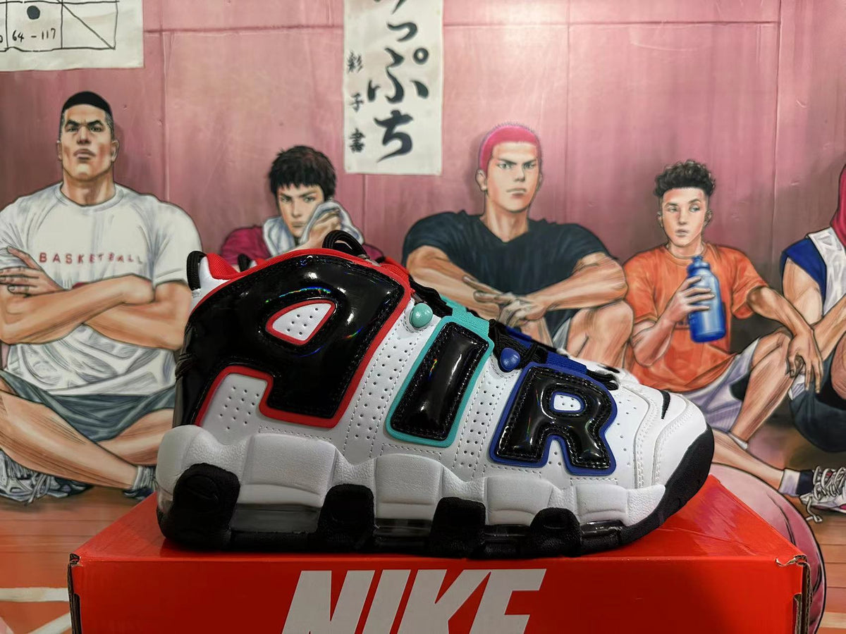 Side view showing oversized AIR lettering on a white, black, red, teal, and blue sneaker.