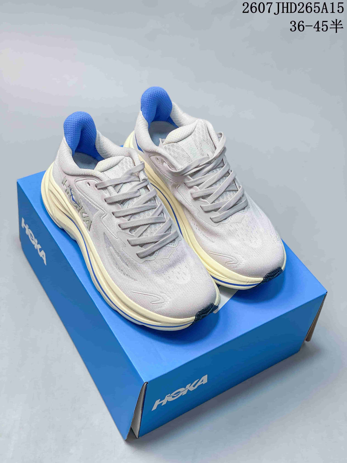 Pair of light-colored HOKA Clifton 10 sneakers displayed on a blue shoebox, with blue accents and an overlaid size range.