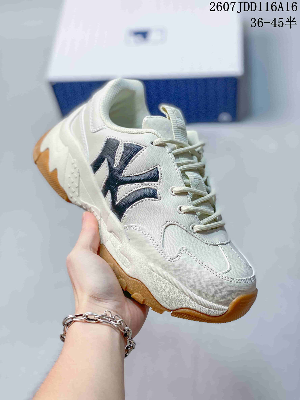 Angled side view of the off-white sneaker showing dark MLB side branding, lace-up fastening and gum-colored outsole.