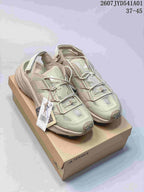 Pale green adidas Terrex outdoor shoes displayed on a box