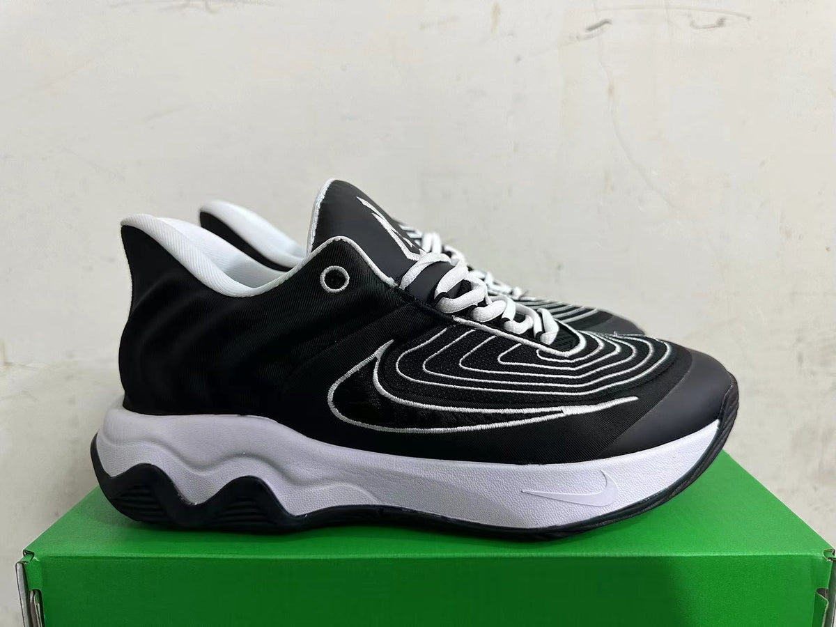 Side view of a black and white Nike sneaker with a sculpted midsole