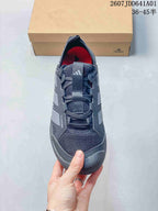 Top view of a gray lace-up sneaker with mesh-look panels and a pull tab.