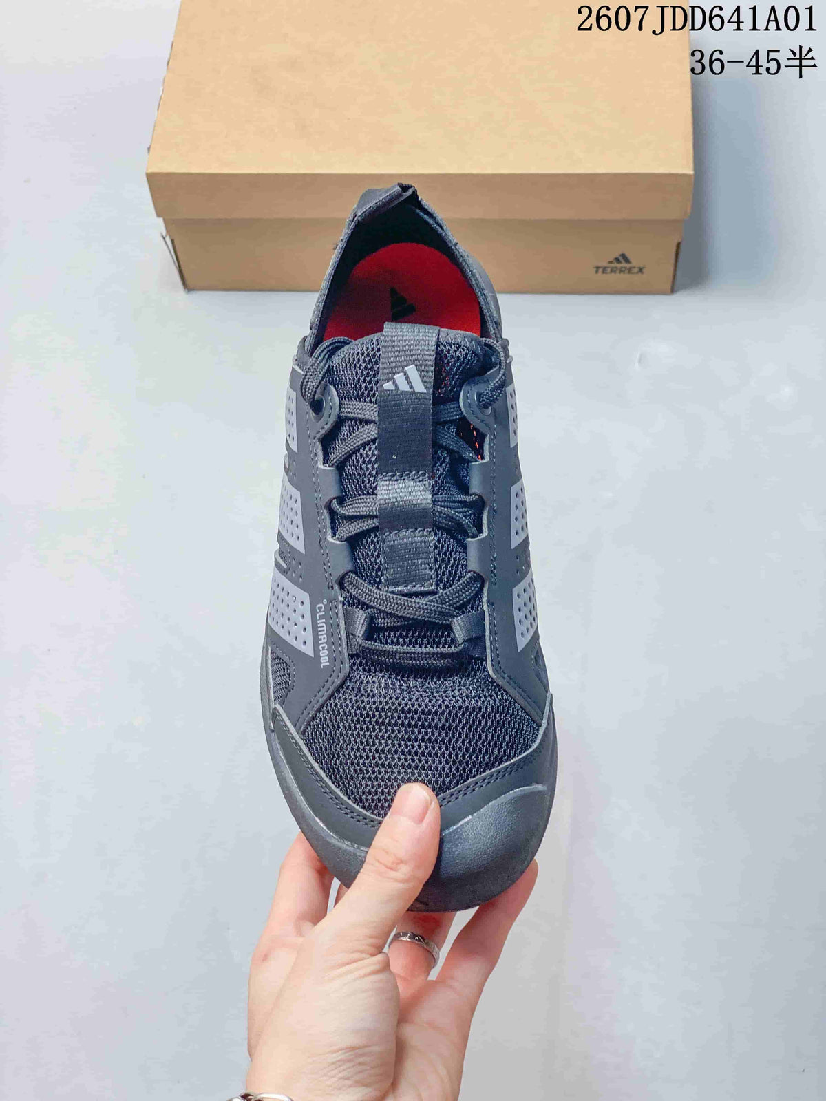 Top view of a gray lace-up sneaker with mesh-look panels and a pull tab.