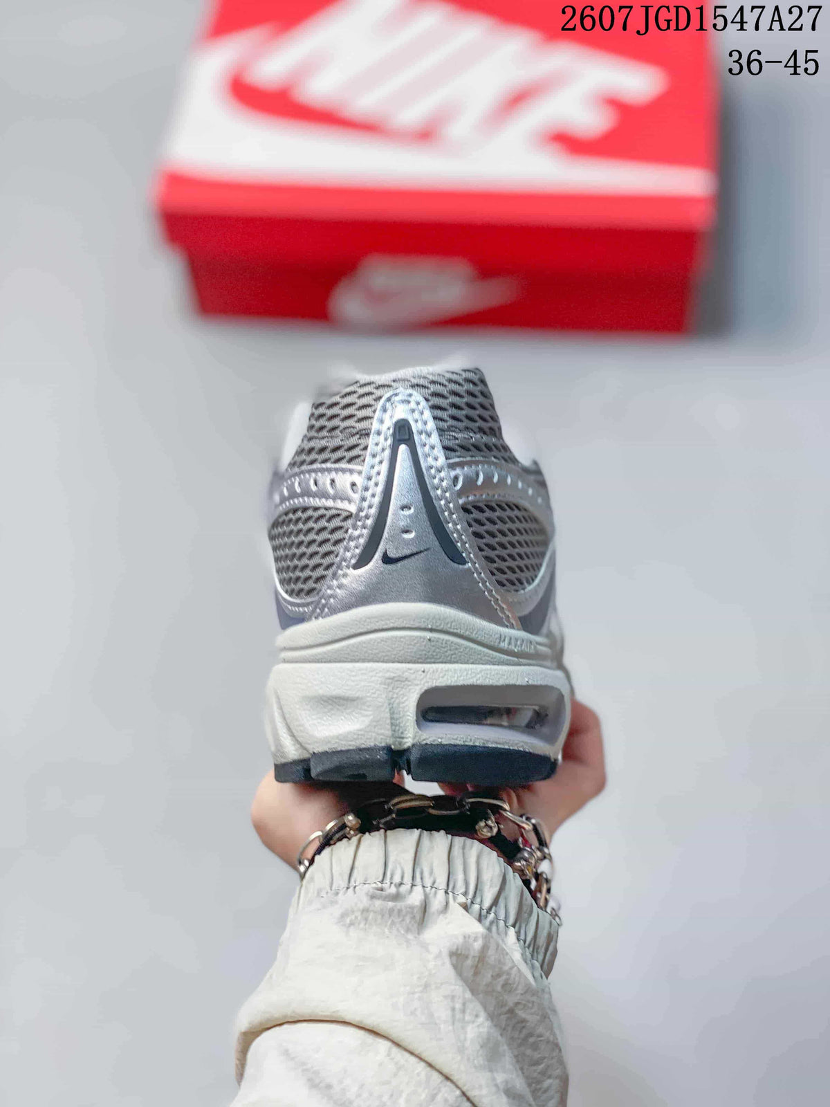 Rear view of the silver and grey sneaker showing the padded heel area and outsole opening.