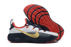 Shoes shown from the side and underside with red patterned outsoles