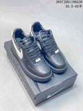 Black and white low-top sneakers displayed on a shoe box, with visible Nike and Ambush branding.