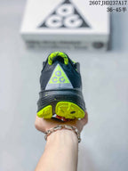 Rear view showing the ACG heel graphic, dark gray upper, and lime outsole sections.