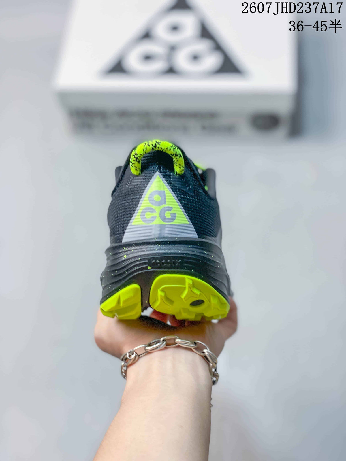 Rear view showing the ACG heel graphic, dark gray upper, and lime outsole sections.