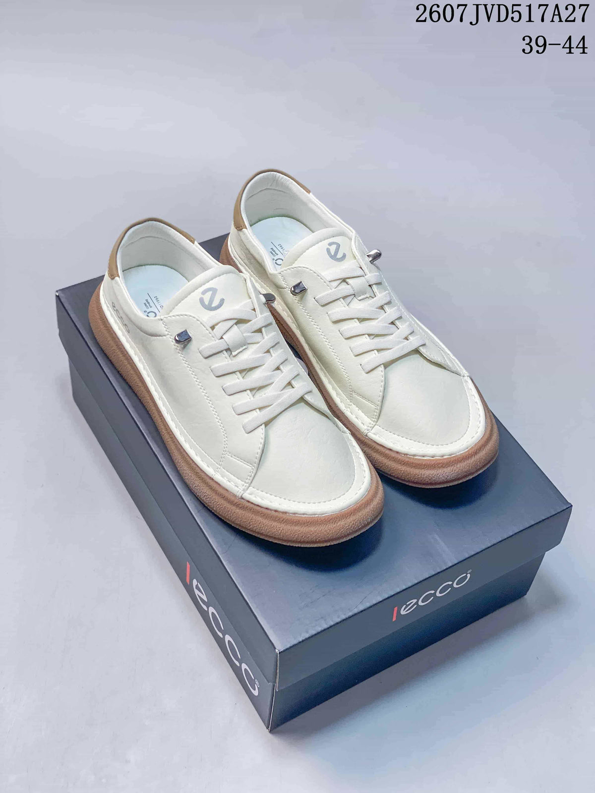 Pair of white ECCO lace-up sneakers with gum-colored soles displayed on a branded shoebox.