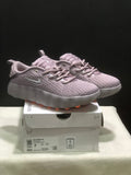 Pair of purple Nike Mind 002 sneakers displayed on the labeled shoe box.