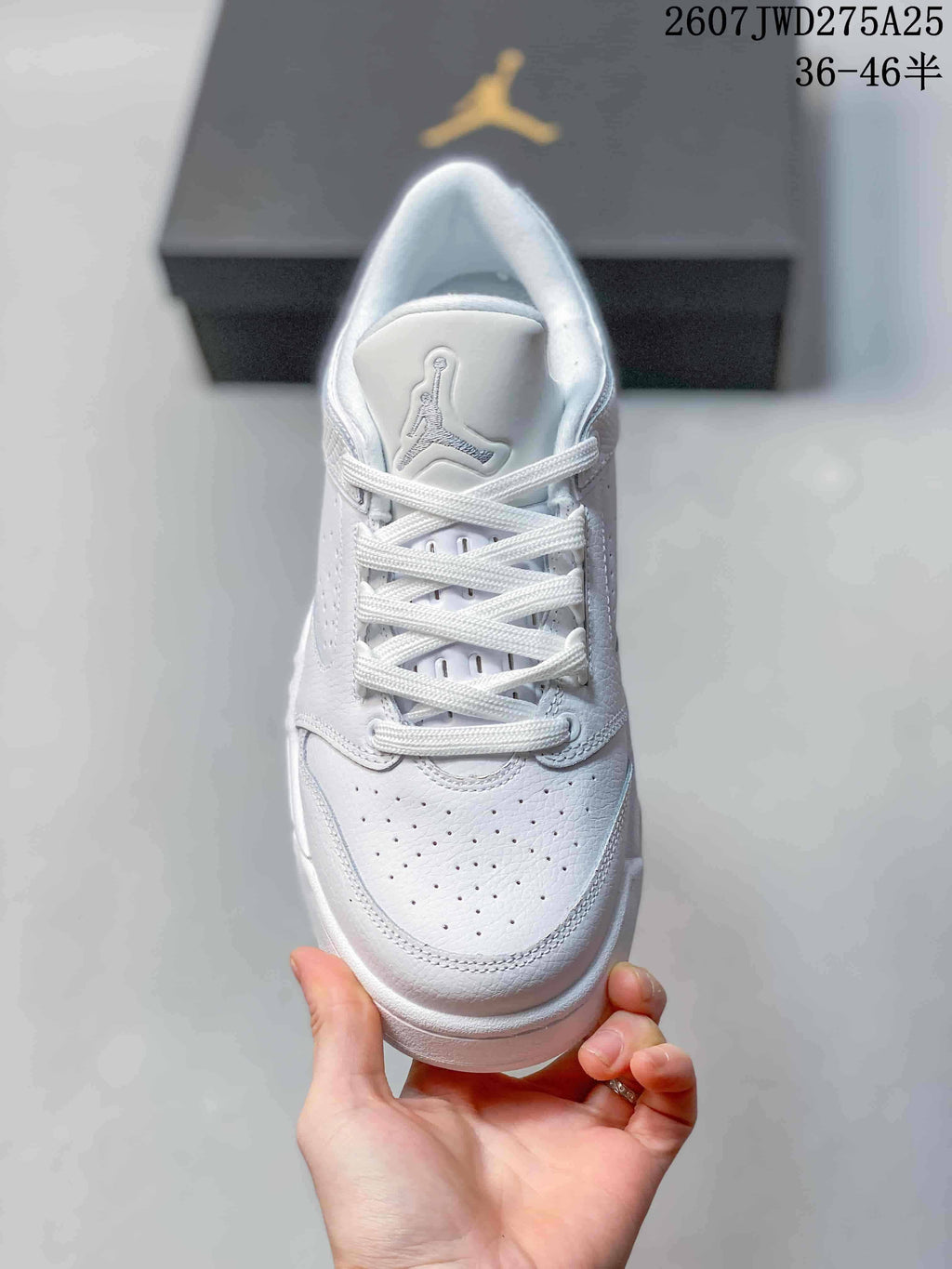 Top view showing the perforated toe box, white laces and tongue logo.