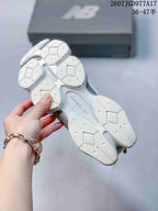 Underside view showing the segmented white outsole and central ABZORB marking.