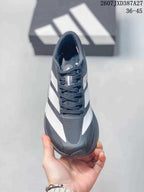 Top view of the sneaker showing black laces, a textured toe panel and contrasting white side detailing.