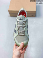 Front view of the sneaker showing mesh panels and lace-up fastening