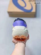 Rear view showing the purple heel, white midsole and tan outsole tread.