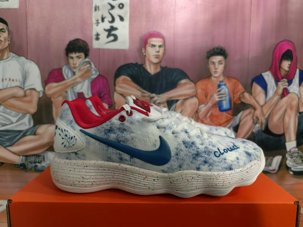 Side view of a Nike shoe with a dark blue swoosh, red collar, and speckled white sole.