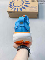 Rear view of the blue ASICS GEL-NIMBUS 27 shoe with white midsole and orange accents