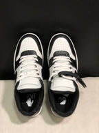 Top view showing white laces, perforated toe boxes, contrasting overlays, and graphic insoles.