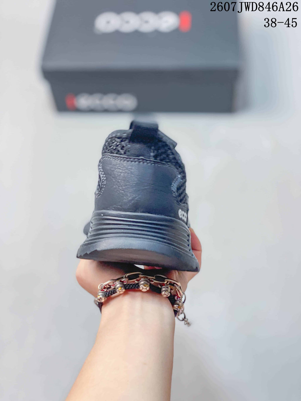 Rear view of a dark gray ECCO sneaker showing the padded heel, pull tab and layered outsole.