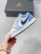 Side profile showing the light blue and white upper, dark blue side branding, white midsole, and blue outsole.