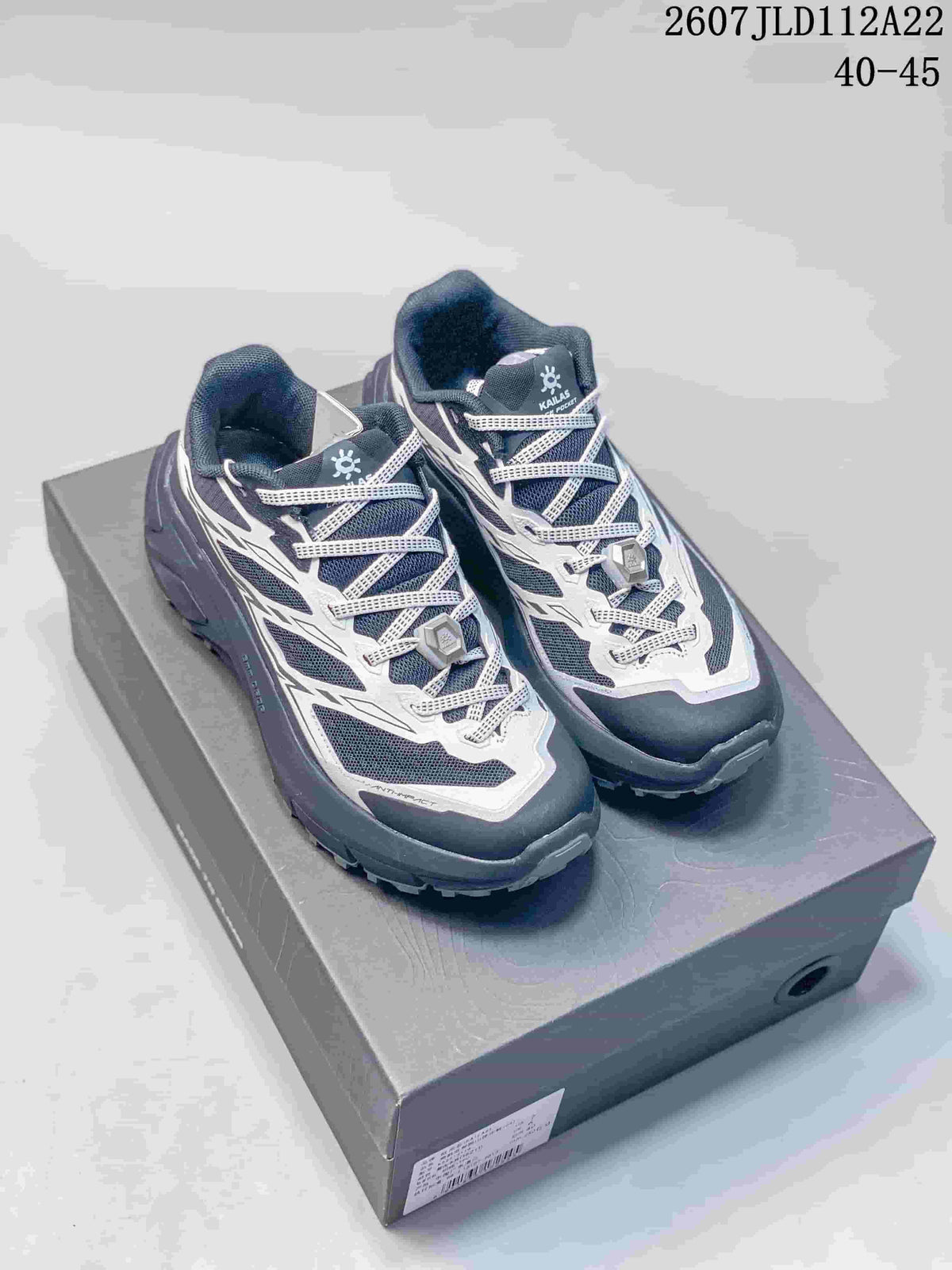 Pair of KAILAS C4 low-top trail shoes in dark navy and white displayed on a shoebox; image text shows 2607JLD112A22 and 40–45.