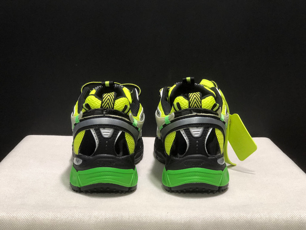 Rear view of the pair showing padded collars, black heel panels, neon green accents, and green outsole sections.