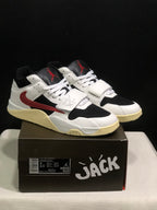 Pair of white, black, and red Jordan Jumpman Jack sneakers displayed on a branded shoe box.