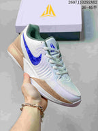 White Nike JA 2 basketball shoe with a blue Swoosh and tan speckled midsole detailing.