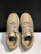 Top view showing the perforated toe panels, tonal laces and branded insoles.