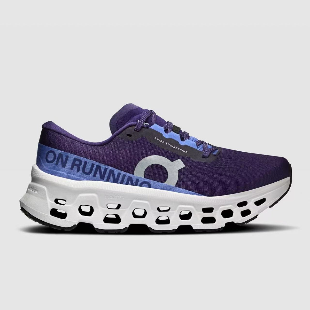 Studio-style side profile of the purple and blue On Cloudmonster 3 shoe against a light background.
