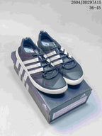 Pair of navy and white adidas Terrex CC Boat shoes displayed on an adidas shoe box; the image shows style code 2604JDD297A15 and size range 36–45.