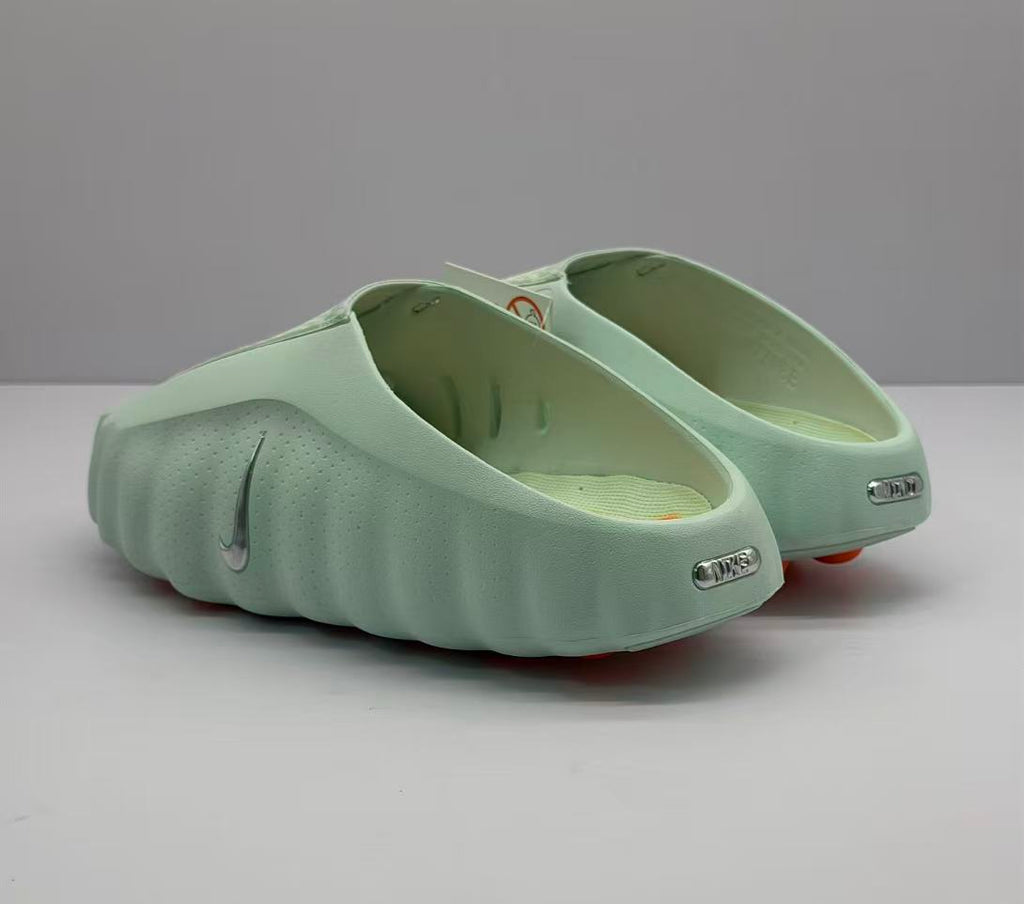Rear view of the pair showing the open heel design, heel branding, and rounded sculpted sole.