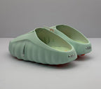 Rear view of the pair showing the open heel design, heel branding, and rounded sculpted sole.