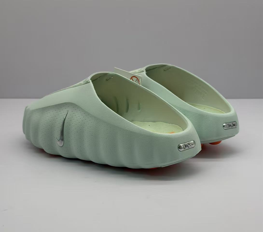 Rear view of the pair showing the open heel design, heel branding, and rounded sculpted sole.