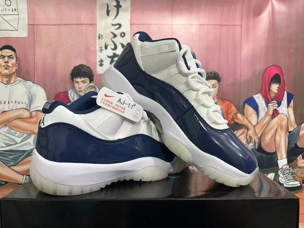 Two navy and white low-top sneakers displayed at an angle, showing the sides and outsoles.
