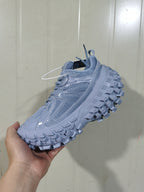 Moon-gray chunky sneaker shown from the opposite side, highlighting the tonal overlays, laces, and textured outsole.