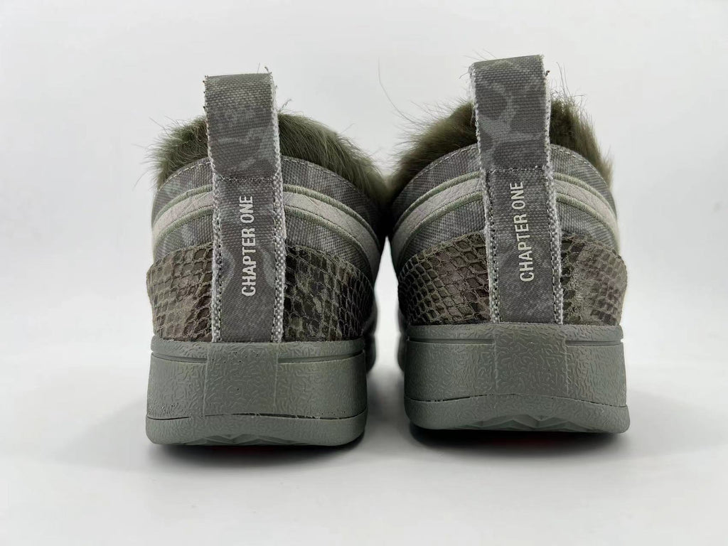Rear view showing heel pull tabs marked “CHAPTER ONE”