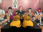 Front view of black and yellow Nike basketball shoes with yellow laces