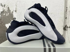Navy and white Adidas basketball shoes displayed together, showing their side panels and outsole.