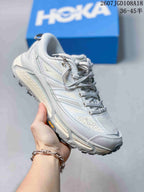 White and light gray HOKA Mafate Speed 2 sneaker shown from a close angled side view.