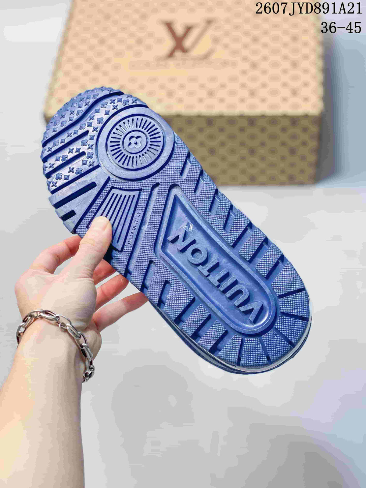 Close view of the blue patterned outsole with circular and linear tread details.